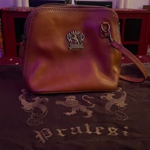 Pratesi crossbody genuine leather with crossbody strap.